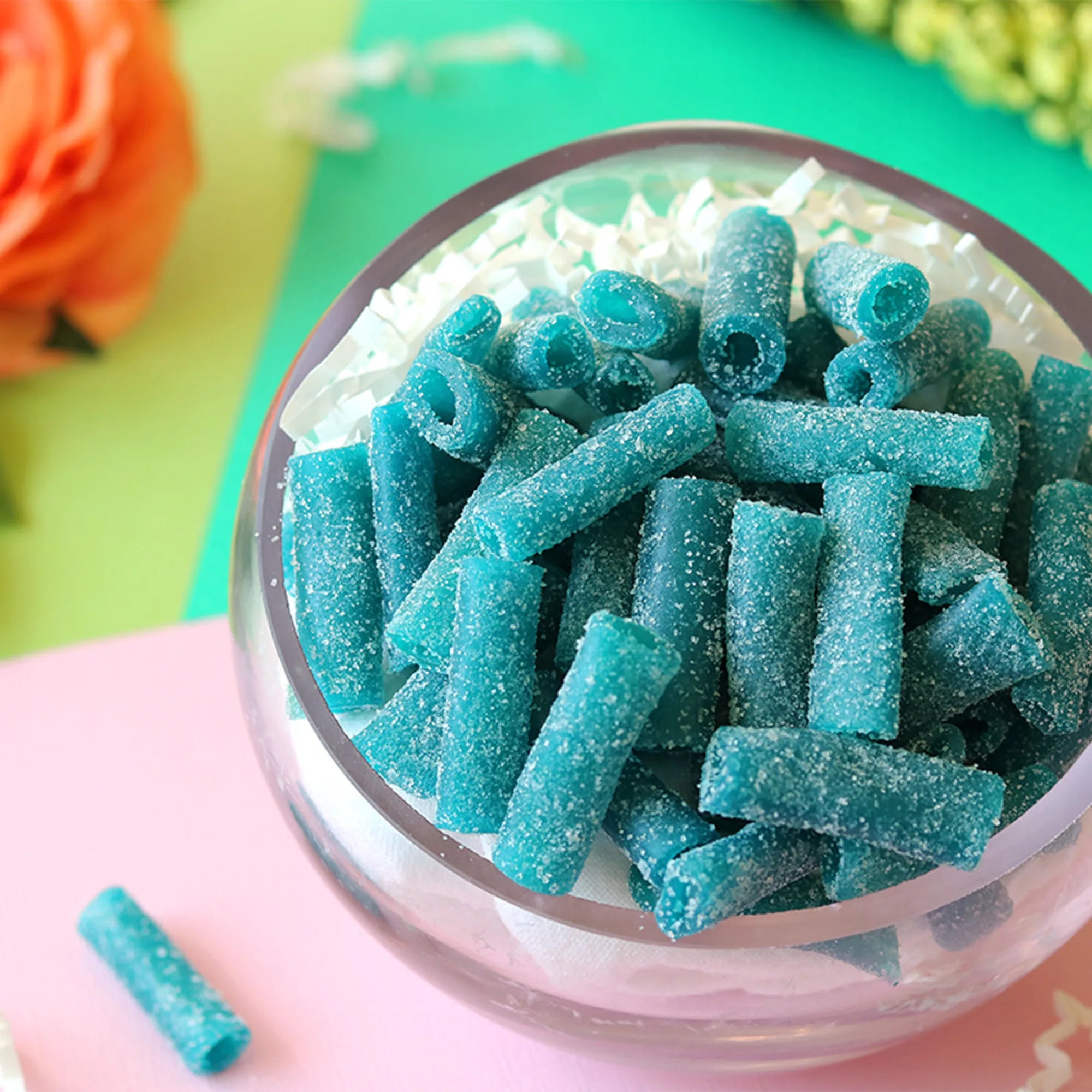 Sour Punch Blue Raspberry Bites candy in a pastel colored spring scene