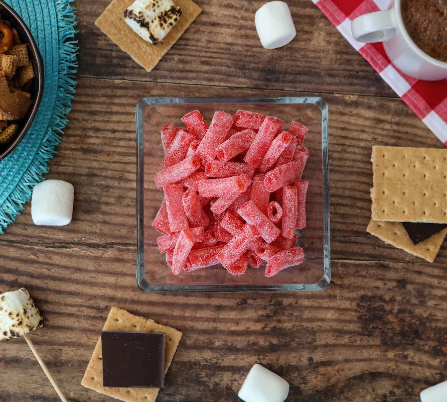 Sour Punch Strawberry Bites alongside s'mores supplies