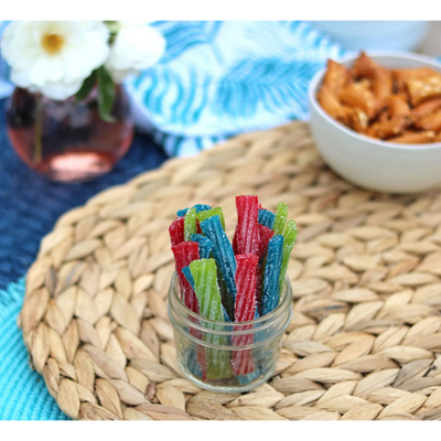 Sour Punch Twists, 3" Individually Wrapped Candy, Assorted Flavors, in a jar near other poolside snacks