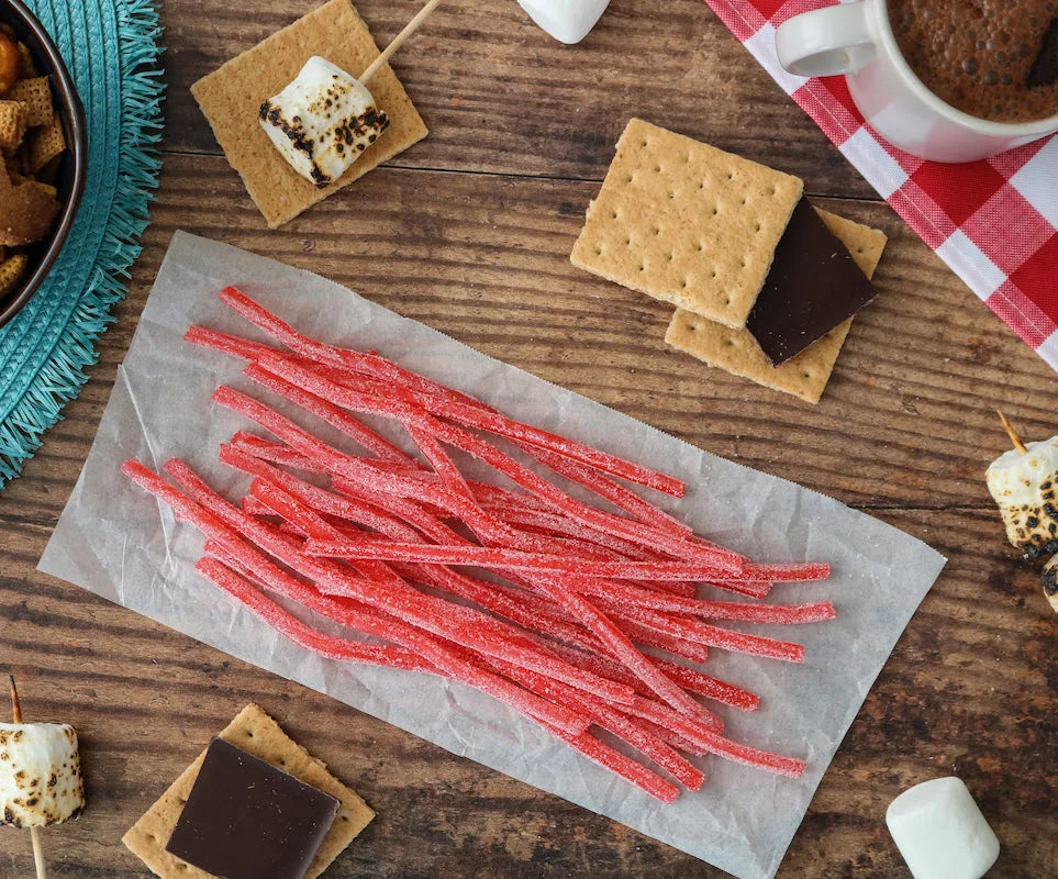 Sour Punch Strawberry Straws Candy alongside s'mores supplies