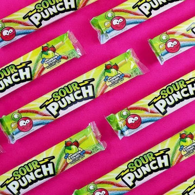 Sour Punch Rainbow Candy Straws 2oz Trays arranged diagonally on hot pink background