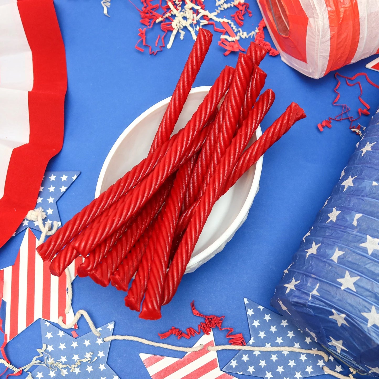 Red Vines SuperStrings licorice candy in a patriotic scene with red, white and blue decorations
