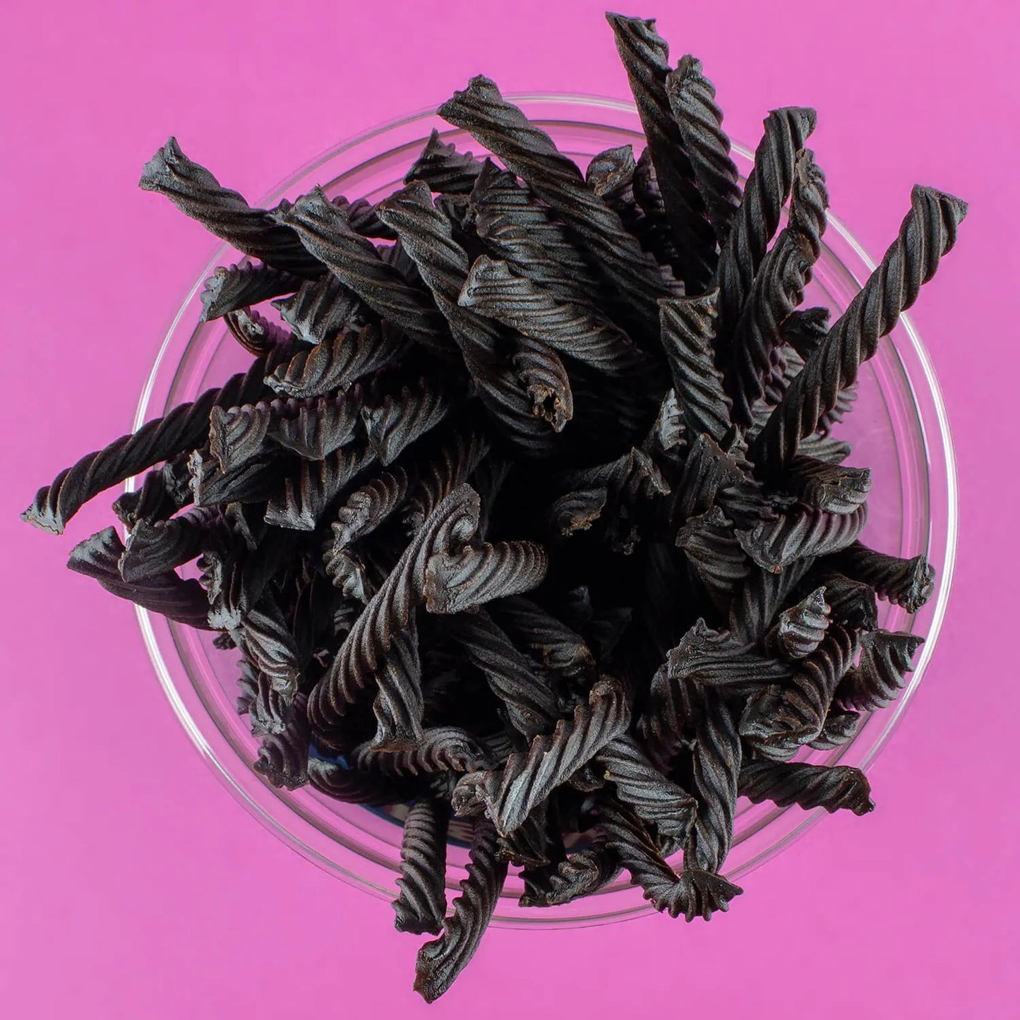 Top down view of a jar full of black licorice twists
