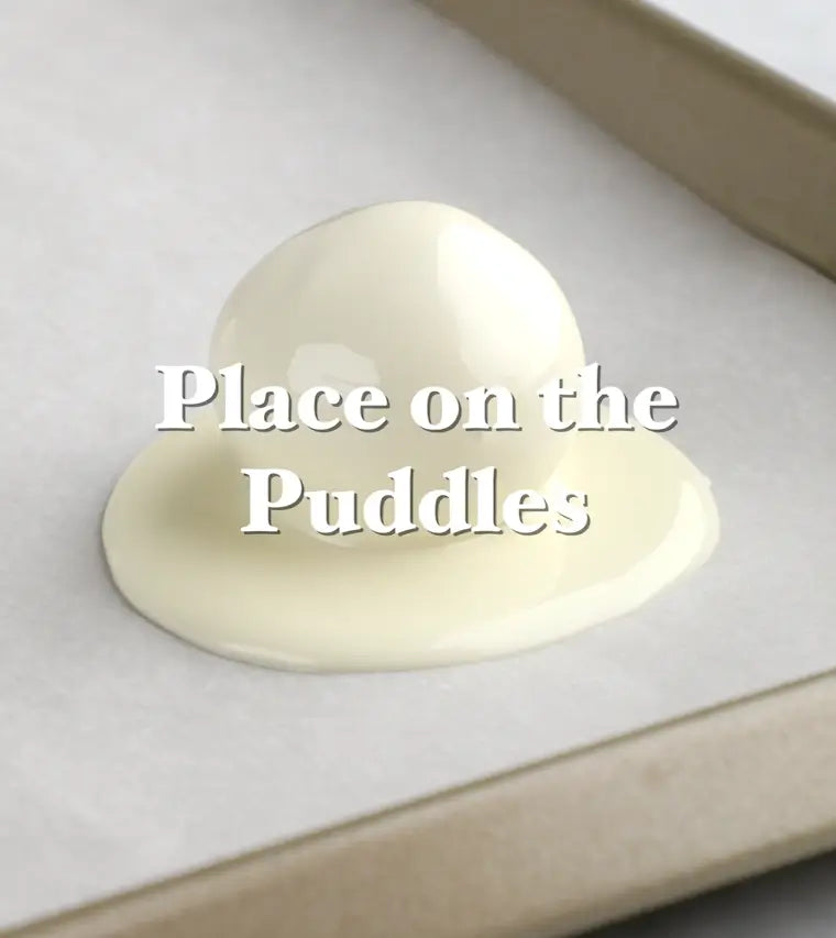 Place Chocolate-Coated Truffles on the Chocolate Puddles