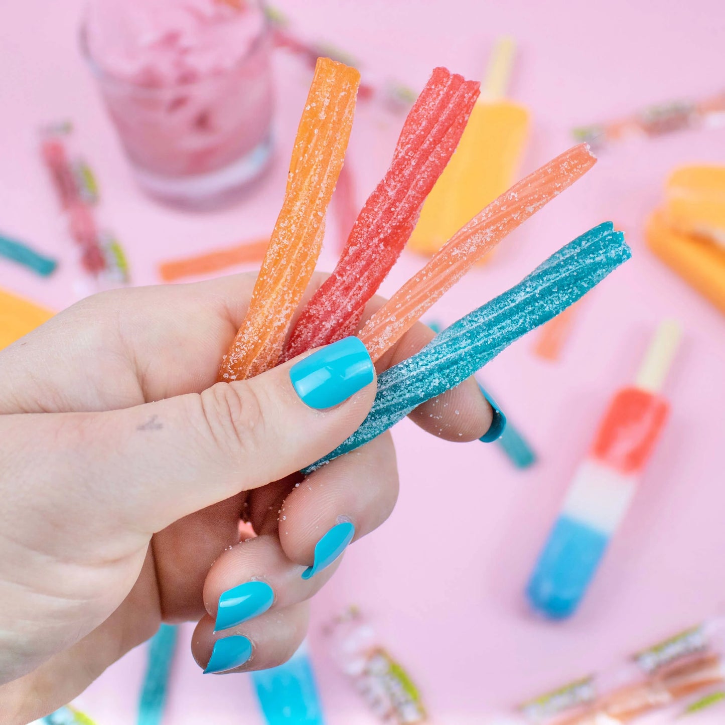Person holding every flavor of SOUR PUNCH Ice Cream Truck Twists summer candy