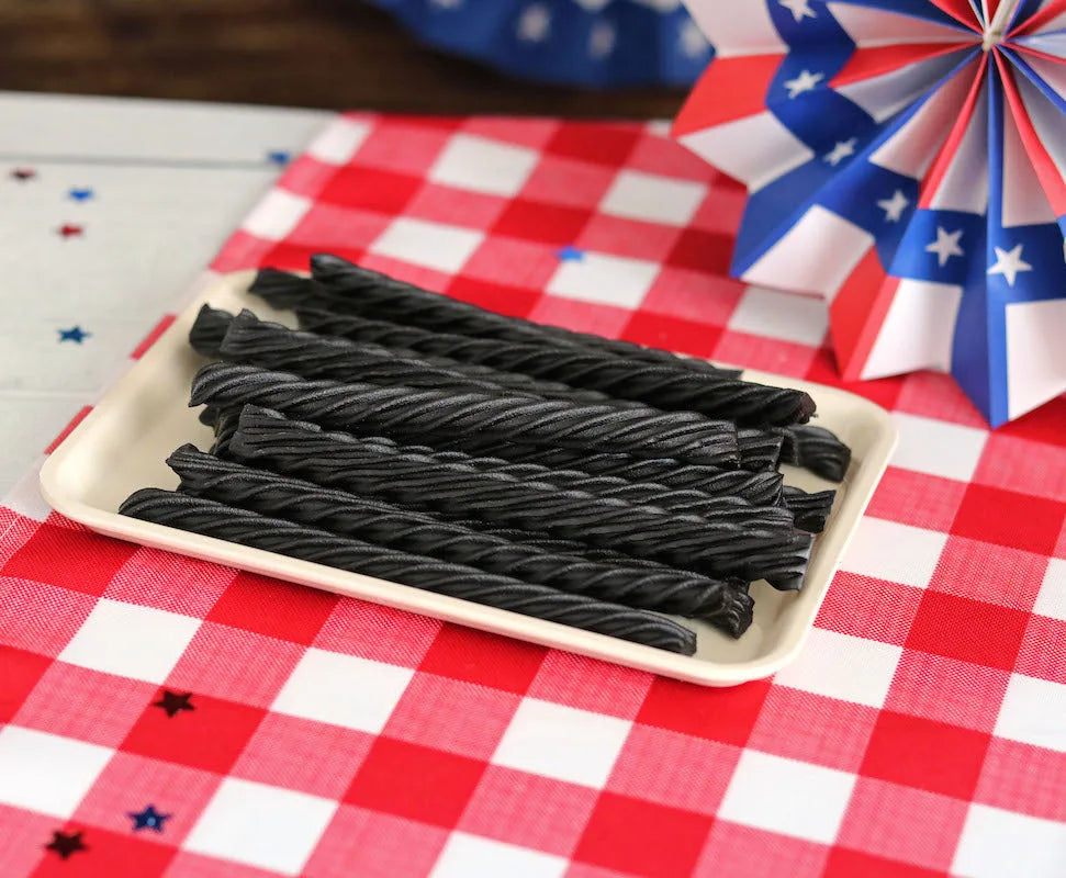 Red Vines Black Sugar Free Licorice Twists on a picnic table with patriotic decorations