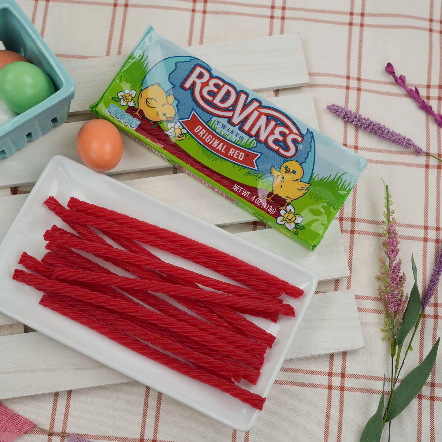 RED VINES Easter Licorice Twists on a snack platter while eggs are being dyed