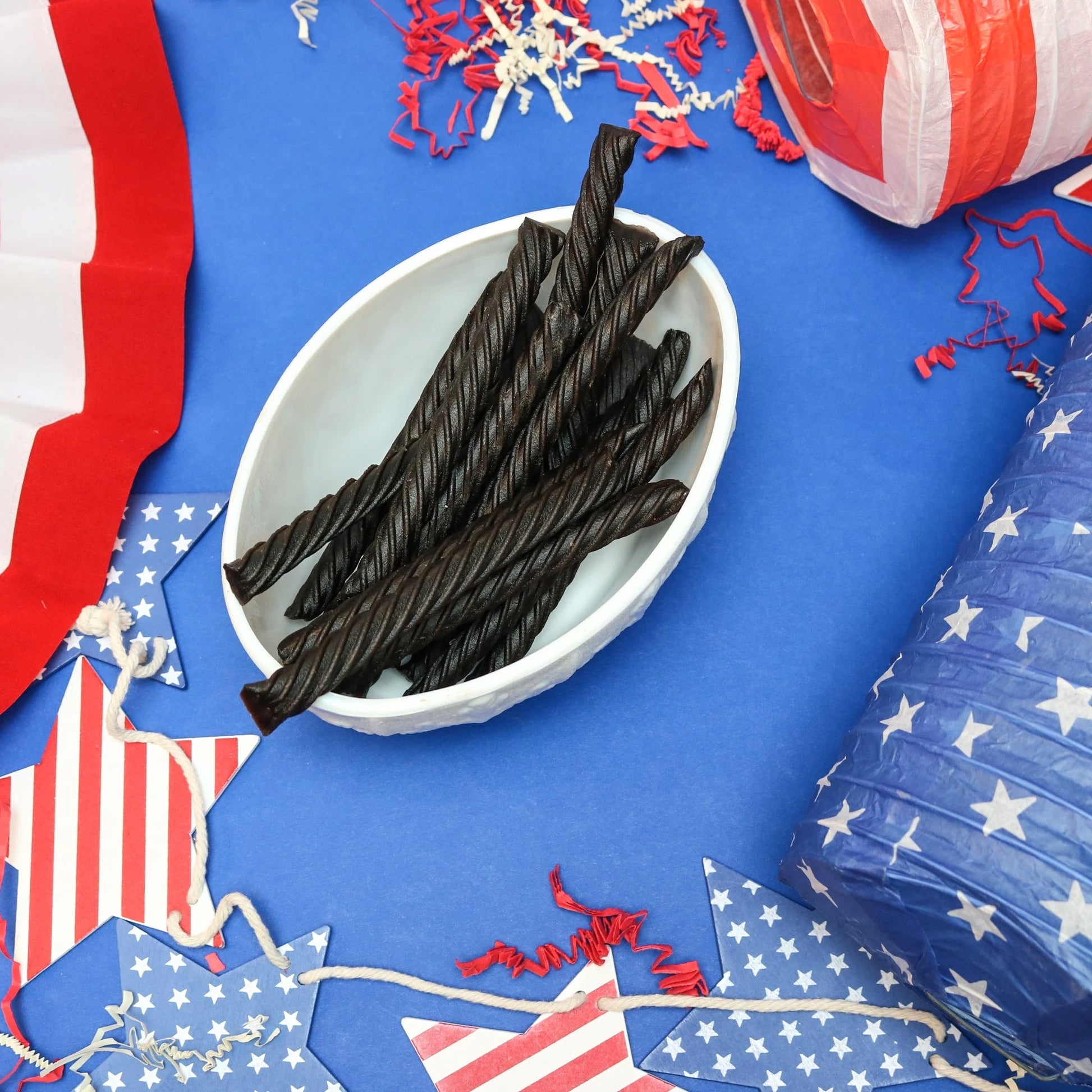 Red Vines Black Licorice Jumbo Twists in a patriotic scene with red, white and blue decorations