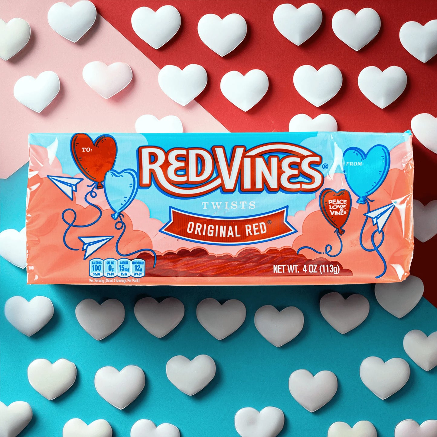 Red Vines Original Red Valentines Day Candy Tray on tri-color background with white hearts