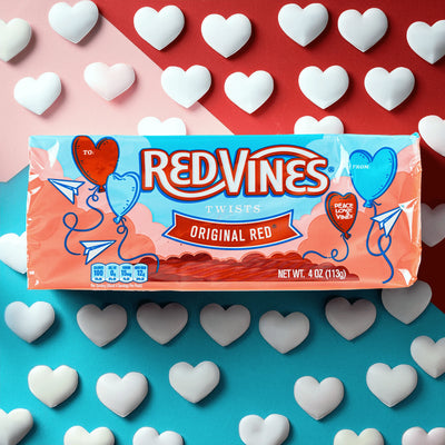 Red Vines Original Red Valentines Day Candy Tray on tri-color background with white hearts