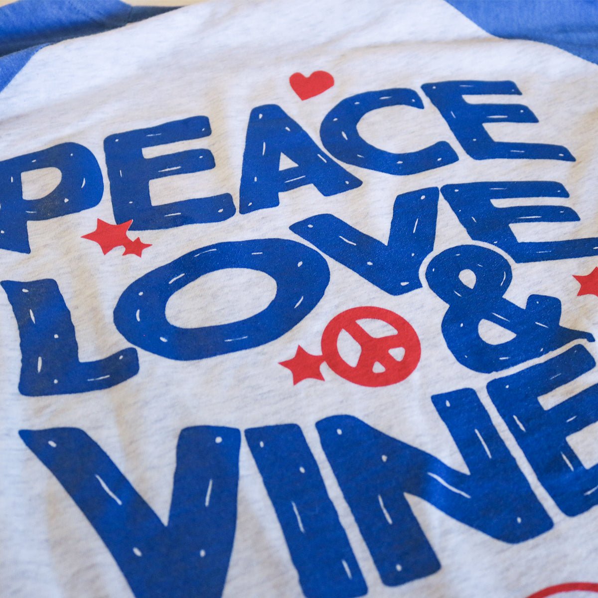 RED VINES Peace, Love & Vines T-Shirt close up of text on the back RED VINES Peace, Love & Vines T-Shirt close up of text on the back