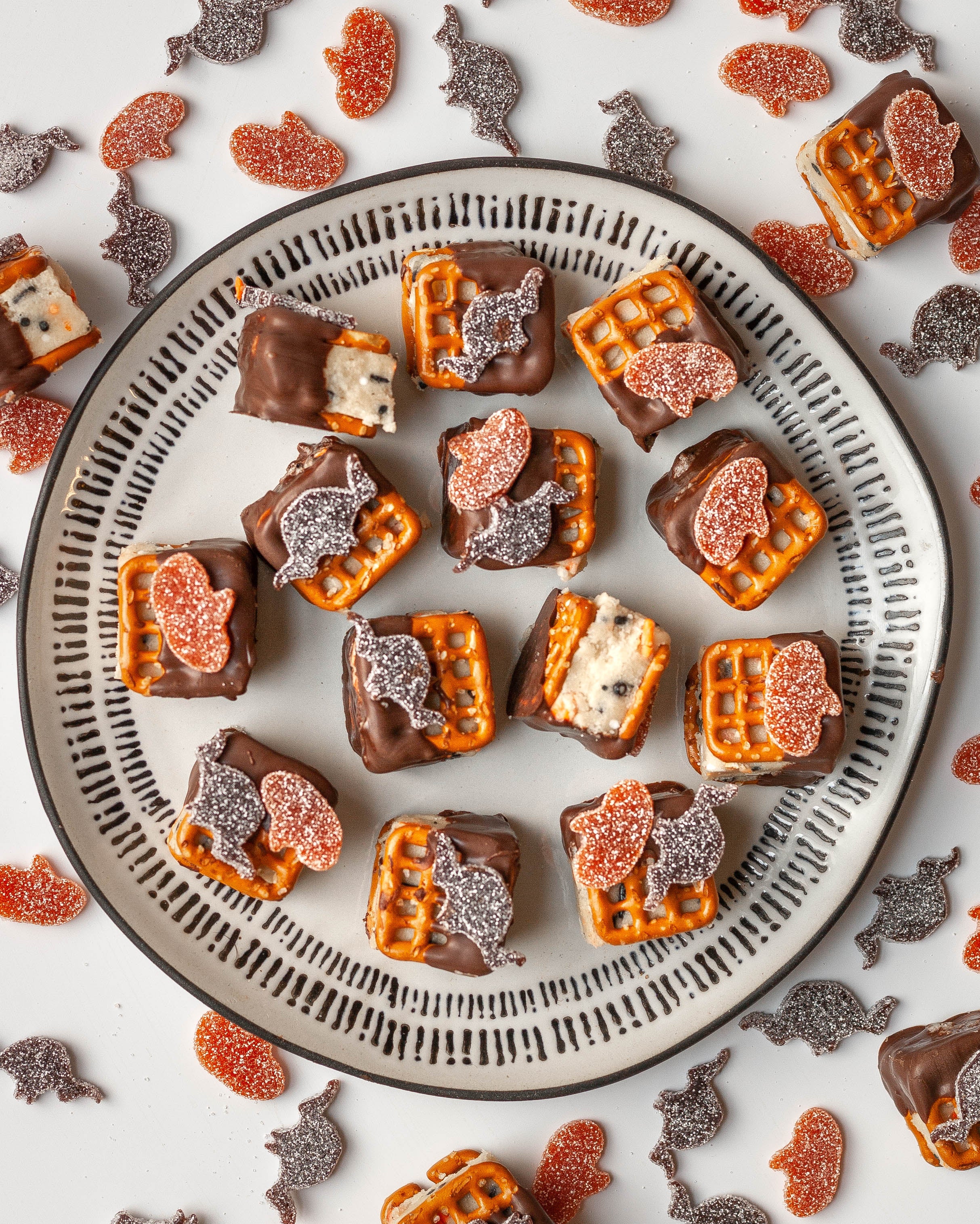 Sour Punch Pretzel Sandwiches filled with edible cookie dough and topped with Bats & Pumpkins Halloween Candy