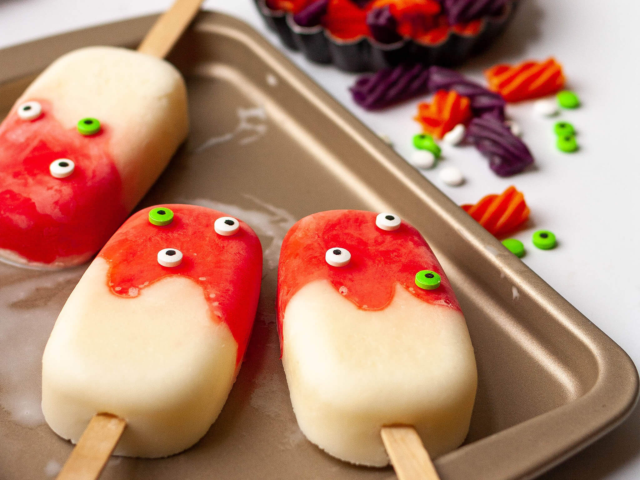 Bloody Vanilla Popsicles made with melted Red Vines