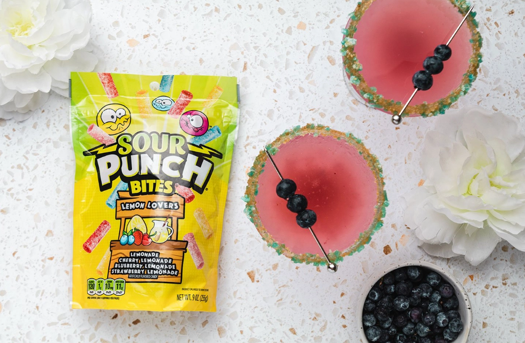 Sour Punch Blueberry Lemon Drop Recipe with drink glasses, blueberries, and Sour Punch Bites candy