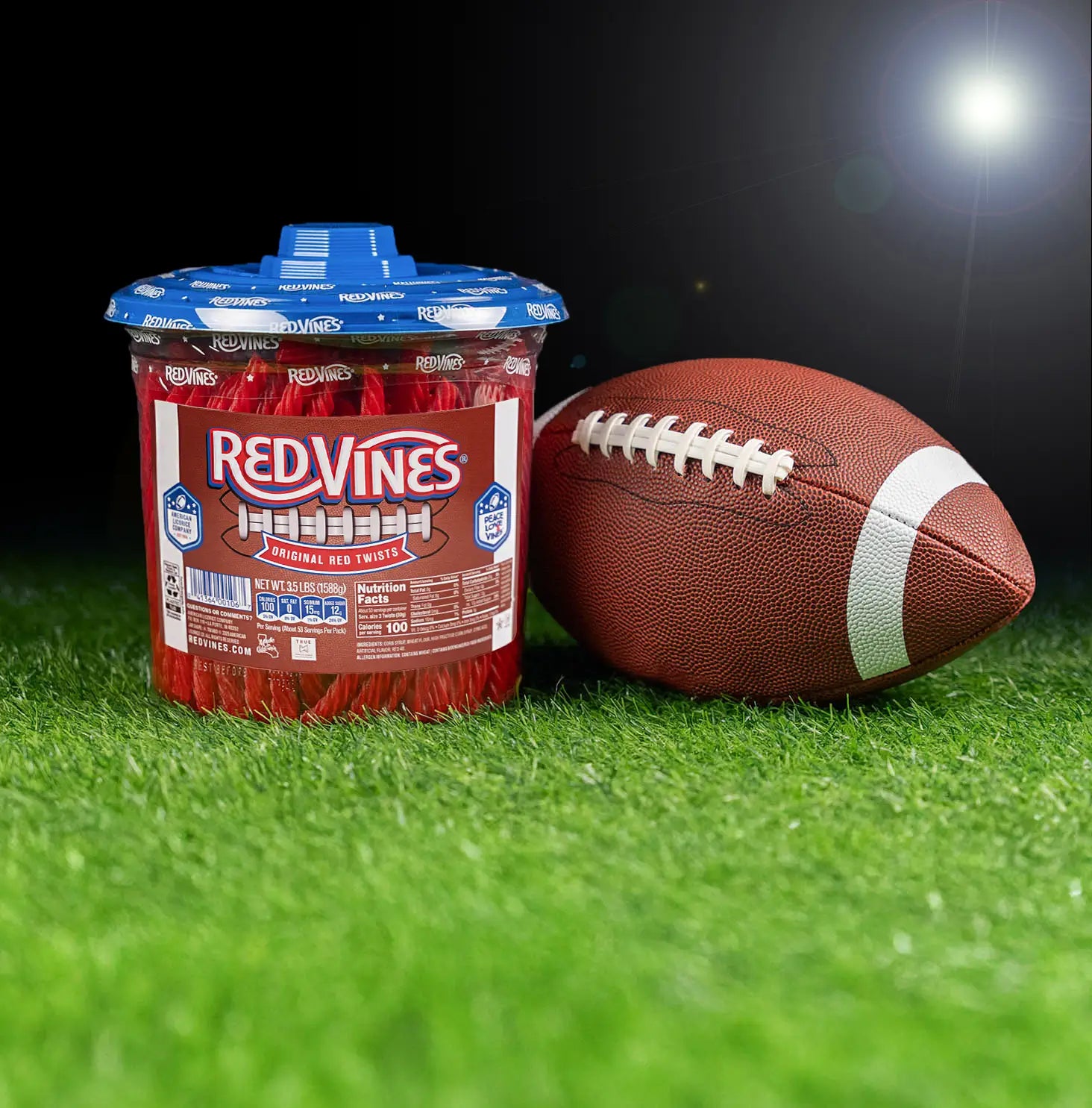 Red Vines Original Red Licorice Candy Twists 3.5lb Jar in limited-edition football graphics next to a football