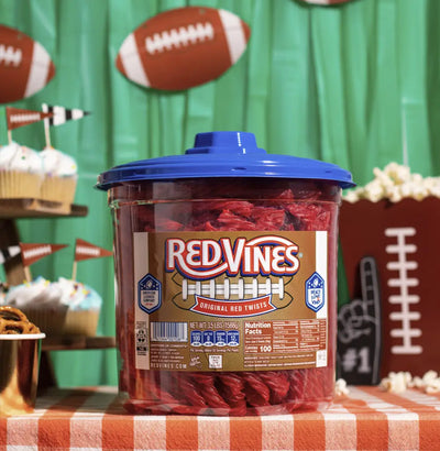 Red Vines Original Red Licorice Twists 3.5lb Jar with limited-edition football graphics on a table with football snacks and decor