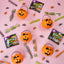 SOUR PUNCH Mummy Mix Halloween Candy items alongside plastic pumpkins