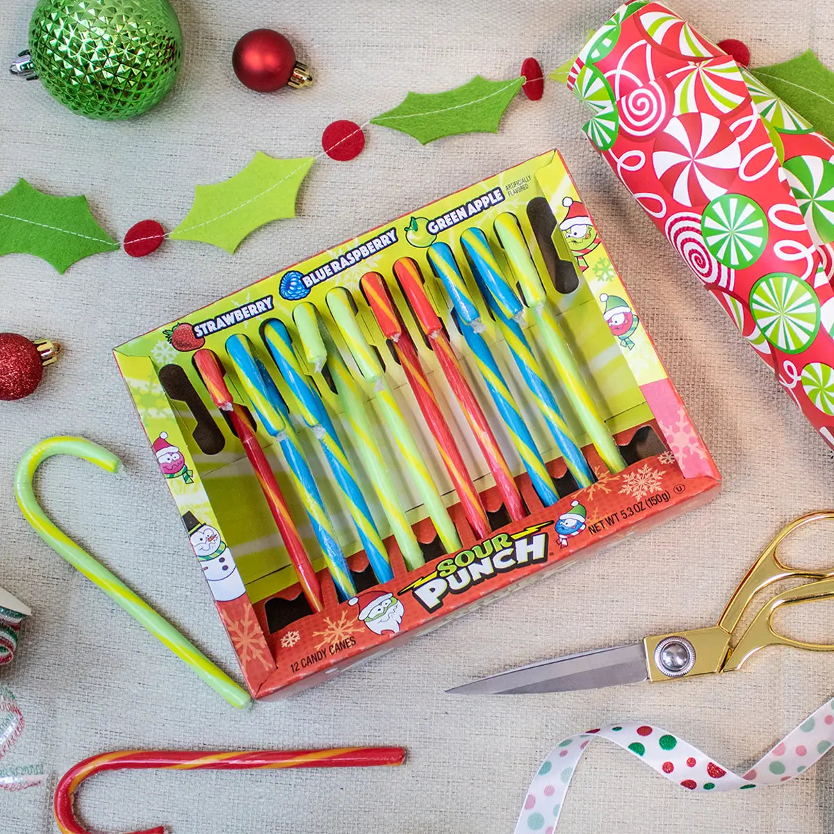 Sour Punch Candy Canes being enjoyed while wrapping holiday gifts