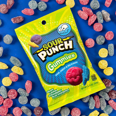 Sour Punch Gummies candy bag on a blue background surrounded by gummy candy shapes
