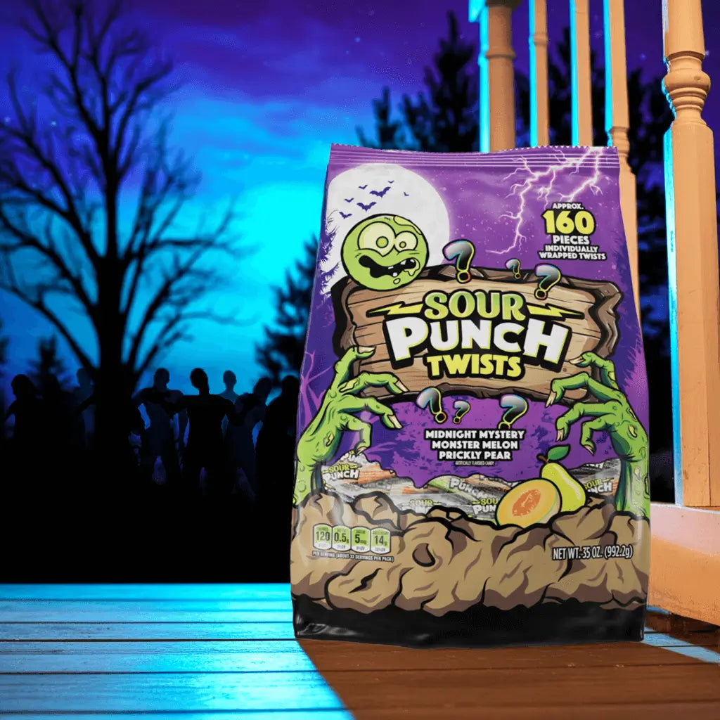 Sour Punch individually wrapped Halloween Twists on a porch with a horde of zombies in the background