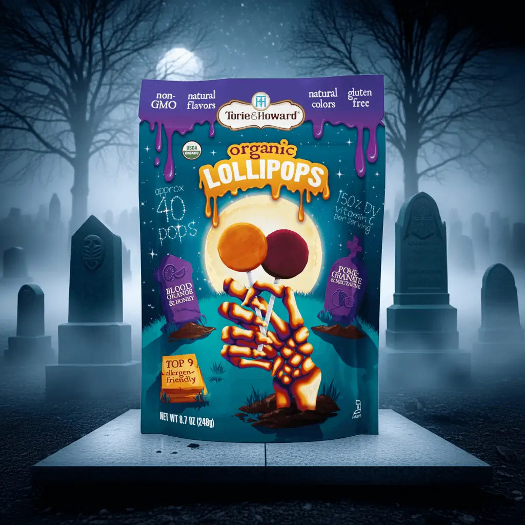Organic Halloween Candy Lollipops on a stone platform surrounded by fog and gravestones