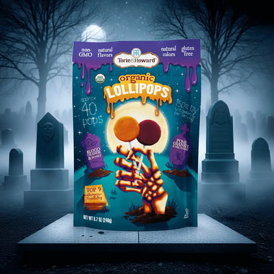 Organic Halloween Candy Lollipops on a stone platform surrounded by fog and gravestones