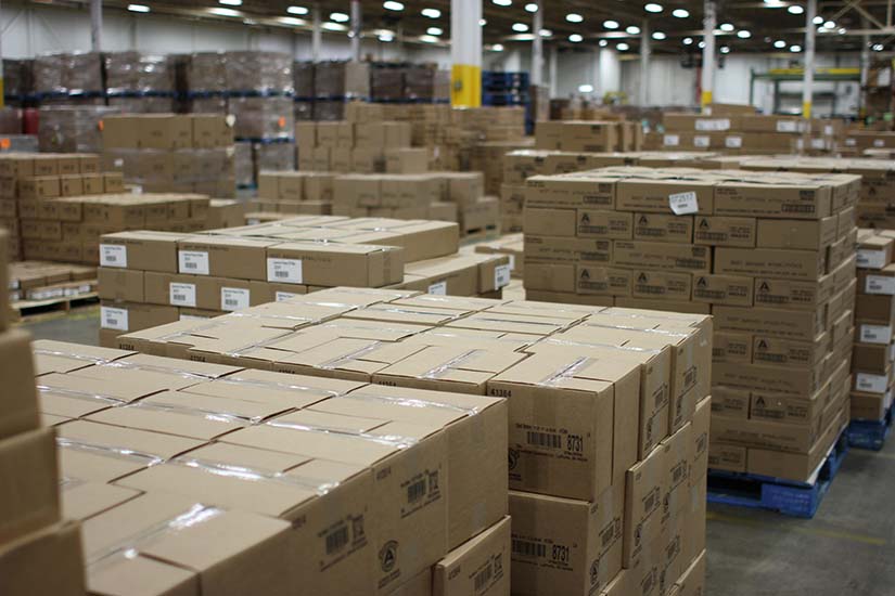 Boxes of candy stacked on pallets filling the American Licorice Company warehouse