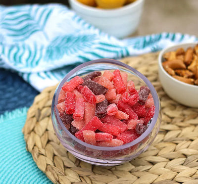 Sour Punch Bites Rad Reds Candy in a bowl near other poolside snacks