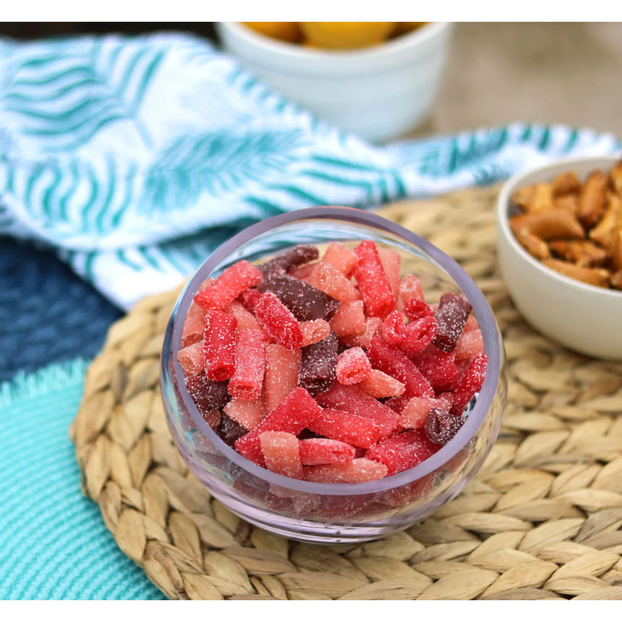 Sour Punch Bites Rad Reds Candy in a bowl near other poolside snacks