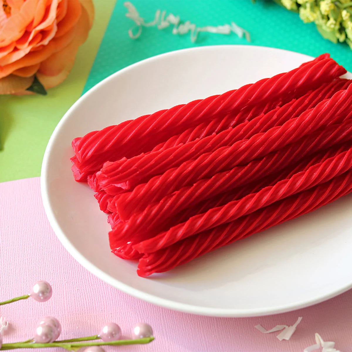 Red Vines Sugar Free Strawberry Licorice Twists  in a pastel colored spring scene