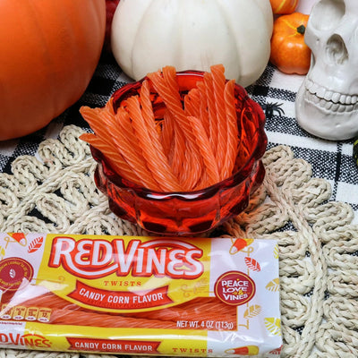 RED VINES Candy Corn Twists, 4oz Tray with orange candy twists in a Halloween bowl