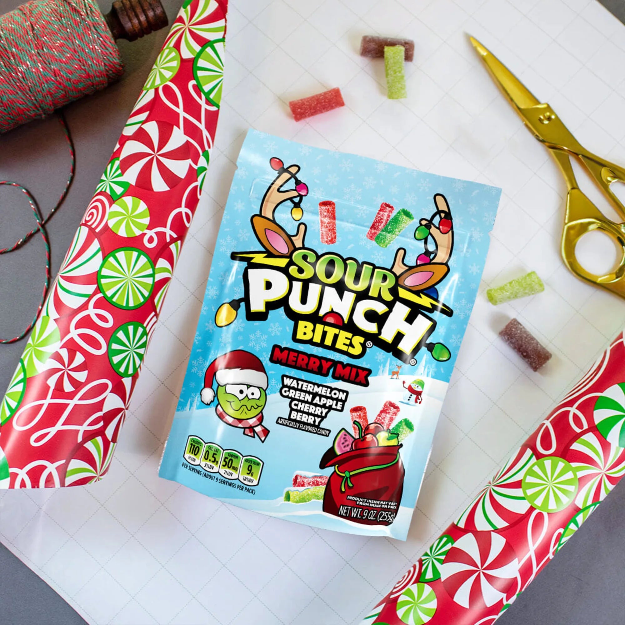 SOUR PUNCH Merry Mix Bites holiday candy being wrapped in wrapping paper