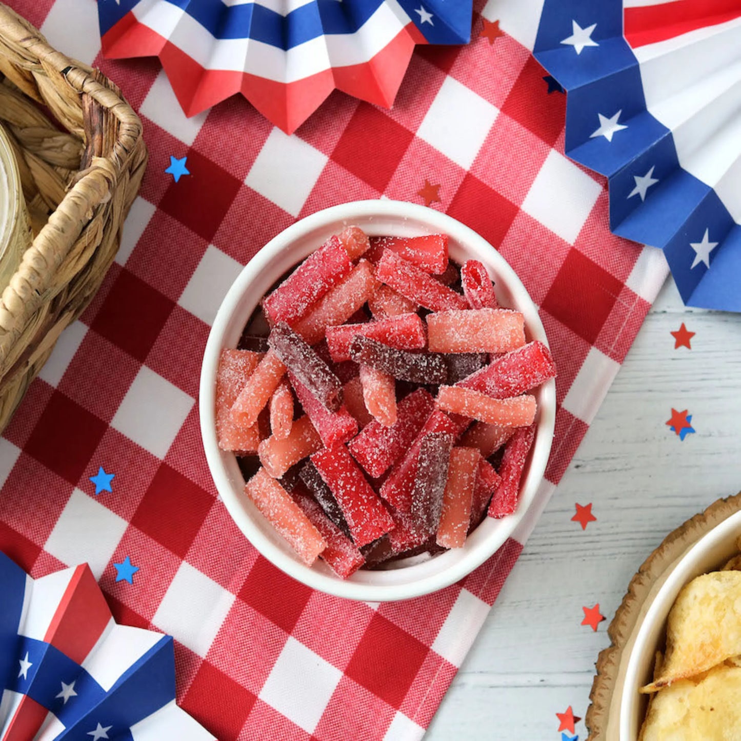 Sour Punch Bites Rad Reds Candy on a picnic table with patriotic decorations