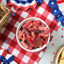 Sour Punch Bites Rad Reds Candy on a picnic table with patriotic decorations