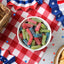 Sour Punch Bites Assorted Flavors on a picnic table with patriotic decorations