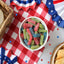Sour Punch Bites Assorted Flavors on a picnic table with patriotic decorations