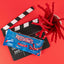 Red Vines Original Red Twisted Vines 2.5oz Bag on a red background with film clapper and raw pull and peel licorice pieces