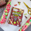 SOUR PUNCH Merry Mix Bites holiday candy being wrapped in wrapping paper