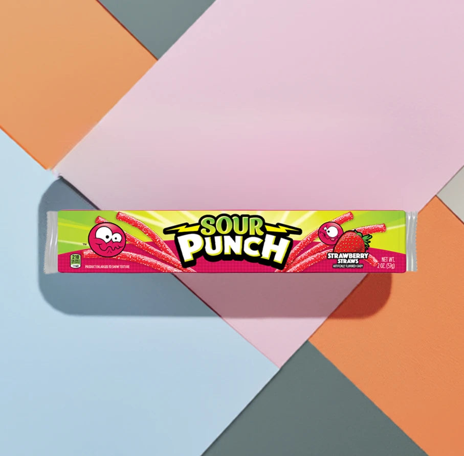 Sour Punch Strawberry Candy Straws 2oz Tray on multicolored squares of construction paper