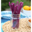 Red Vines Grape Licorice Twists in a jar near other poolside snacks