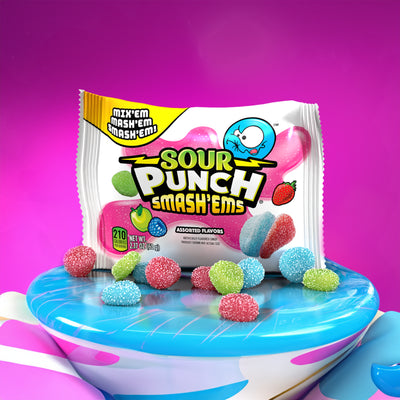 Sour Punch Smash'ems 2oz Pouch on a light blue platform with hot pink background