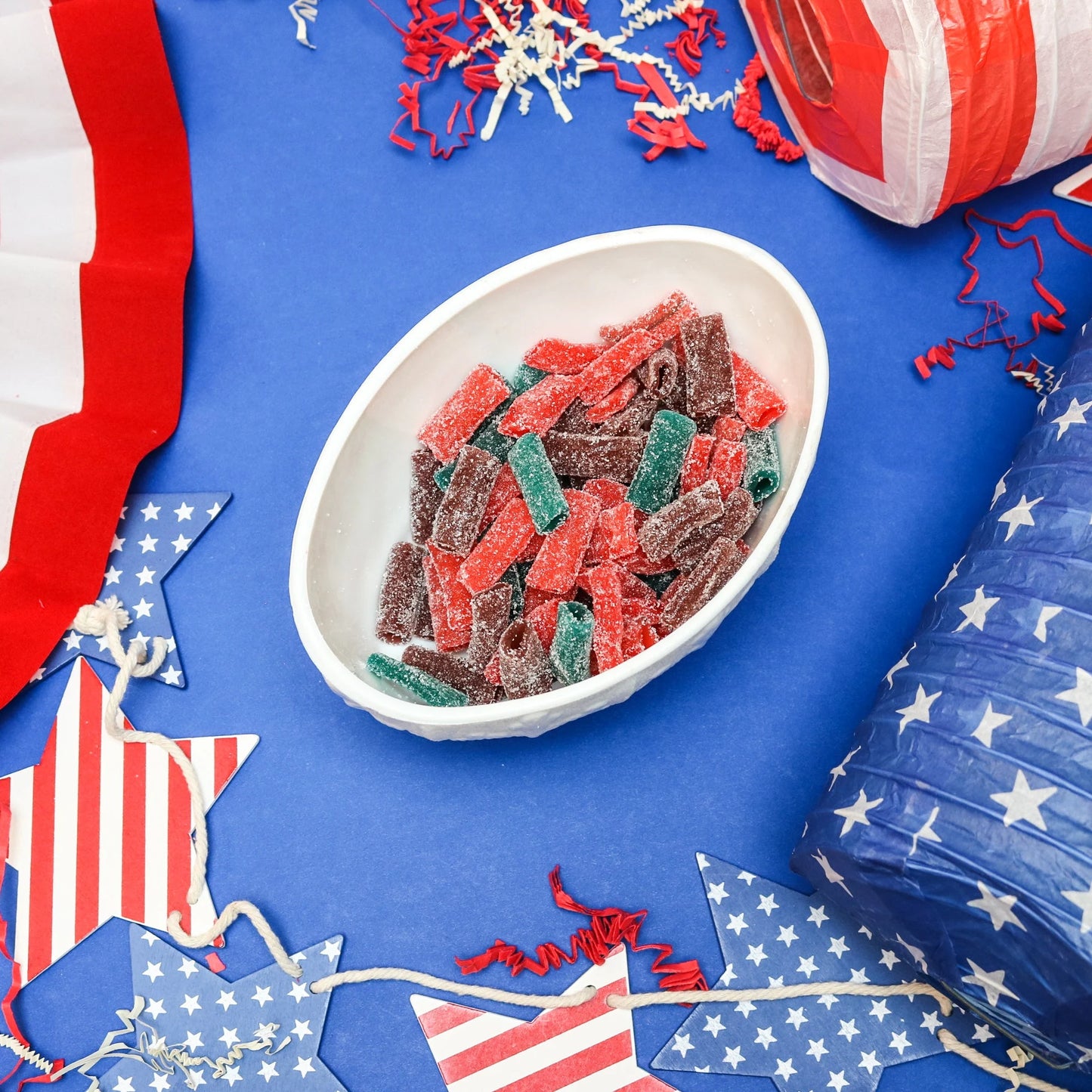 Sour Punch Sweet Bites candy in a patriotic scene with red, white and blue decorations