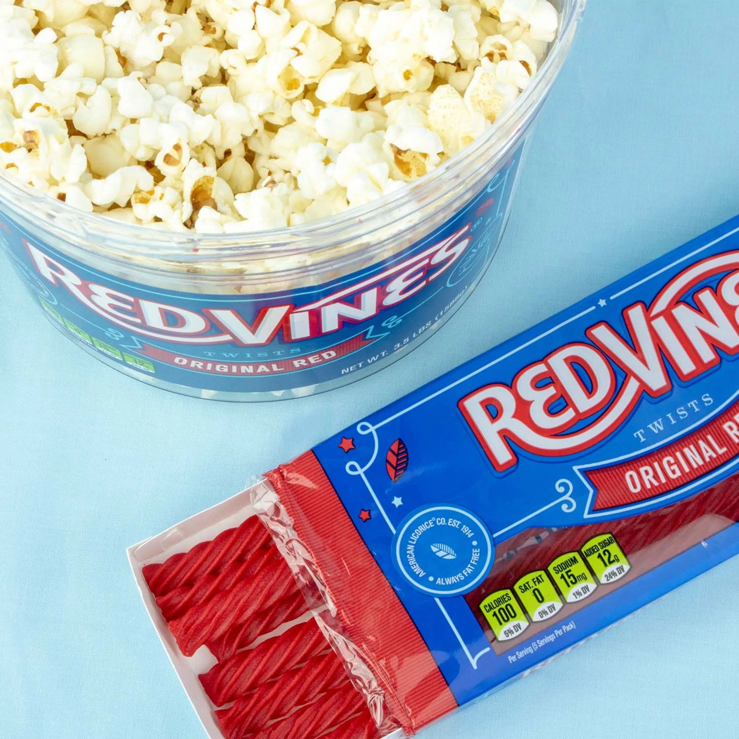 Open Red Vines Original Red Tray with a Red Vines Jar full of Popcorn