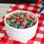 Bowl of Sour Punch Assorted Mini candy on a red and white checkered cloth