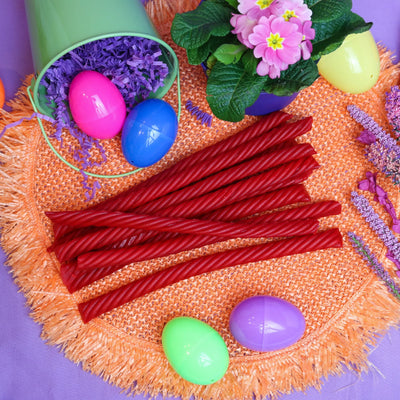 Red Vines SuperStrings licorice candy surrounded by plastic Easter eggs