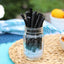 Red Vines Black Sugar Free Licorice Twists in a jar near other poolside snacks