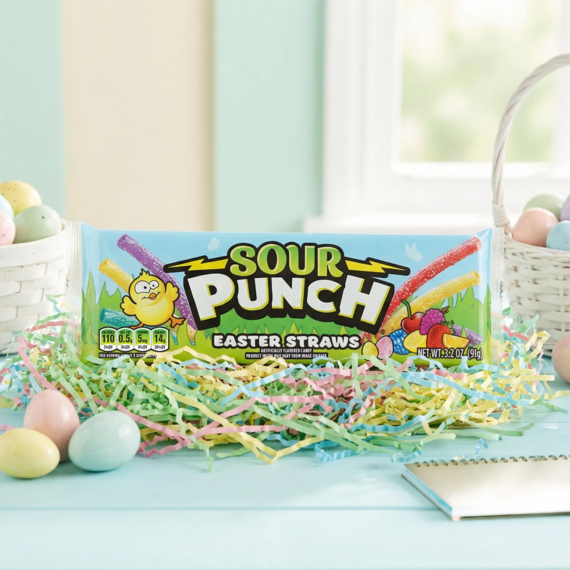 Sour Punch Easter Candy Straws with colorful confetti and a white Easter basket on each side