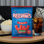 Red Vines Jumbo Twists Bag on a coffee table with popcorn and soda