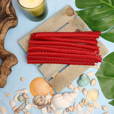 Red Vines SuperStrings licorice candy in a summer scene with seashells and beach wood