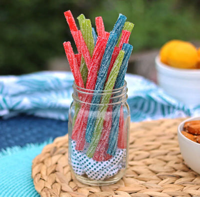 Sour Punch Twists, 6" Individually Wrapped Candy, Assorted Flavors, in a jar near other poolside snacks